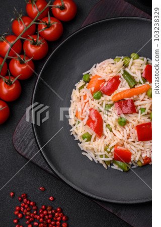 Delicious boiled rice with peppers, peas, asparagus beans and carrots 103238329