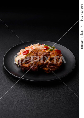 Delicious boiled rice with peppers, peas, asparagus beans and carrots and fried chicken 103238364
