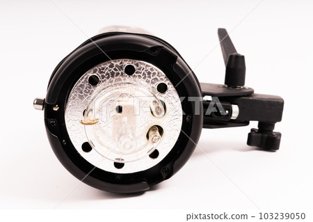 Studio light flash lamp closeup on white background isolated 103239050