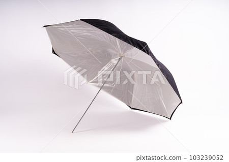 Photography studio light reflector - isolated on white background umbrella. Photography studio light reflector - isolated on white background umbrella. 103239052