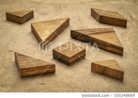 seven tangram wooden pieces, a traditional Chinese puzzle game, texture bark paper background seven tangram wooden pieces, a traditional Chinese puzzle game, texture bark paper background 103240669