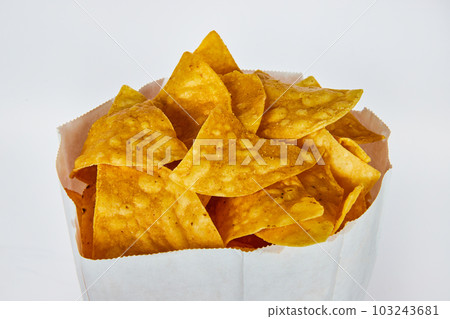 Top view of back of gluten free tortilla or salsa dipping chips on white background Top view of back of gluten free tortilla or salsa dipping chips on white background 103243681