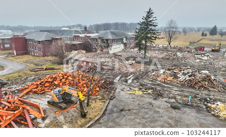 Aerial of construction site in Indiana with rubble and metal piles 103244117