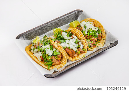 Cilantro lengua meat and lime tacos on tray with white background asset Cilantro lengua meat and lime tacos on tray with white background asset 103244129