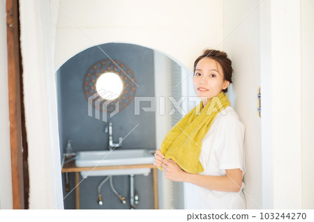 Photo of a woman getting dressed in the morning Photo of a woman getting dressed in the morning 103244270