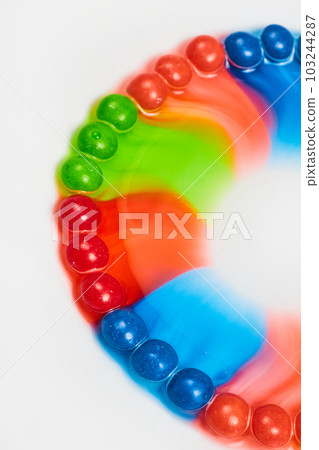 Skittles Candy Color Spread on White Background 103244287