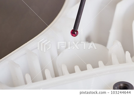 Metrology CMM programming machine probe inspecting plastic part for minute flaws Metrology CMM programming machine probe inspecting plastic part for minute flaws 103244644