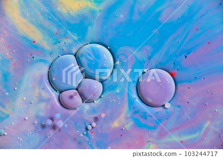 Bubble sphere cells in purple, blue, and yellow oil and paint cosmic colorful swirling abstract art 103244717