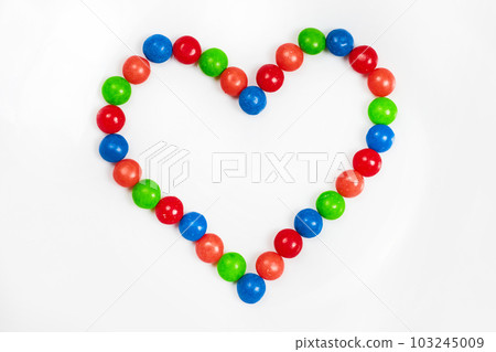 Valentines day heart shape of skittles candy on white background with colors blue and red and orange and green asset Valentines day heart shape of skittles candy on white background with colors blue and red and orange and green asset 103245009