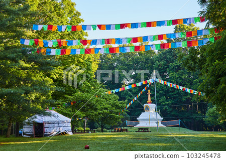 Tibetan Mongolian Buddhist Chorten and Prayer Flags in field 103245478
