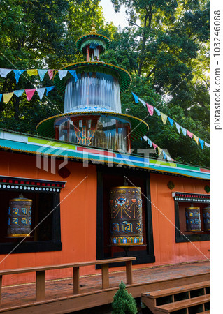 Detailed prayer wheels inside of Tibetan Mongolian Buddhist shrine 103246088