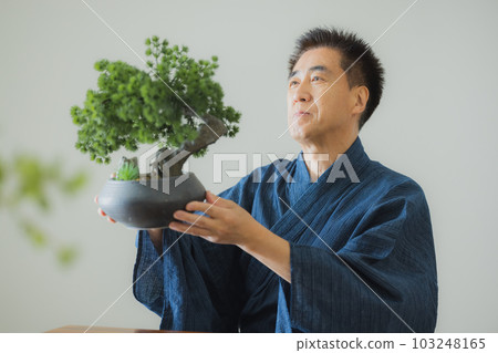 A middle-aged man in a yukata A middle-aged man in a yukata 103248165