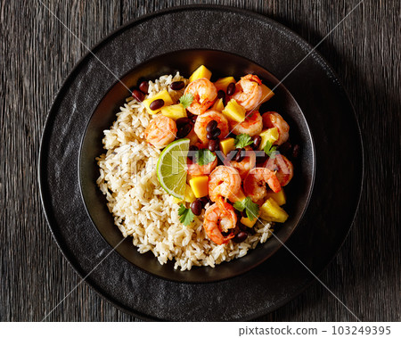shrimps with beans, mango, brown rice in bowl shrimps with beans, mango, brown rice in bowl 103249395