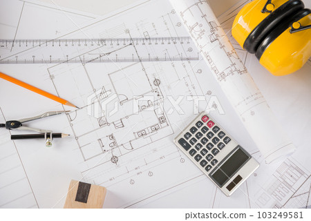 Architectural project workplace. Top view of house plan blueprint paper with repair tools on table desk at architecture office, Engineering architect design tools concept 103249581