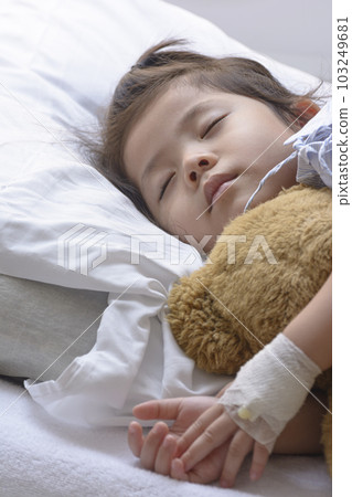 Little Asian Thai Girl, Recovering Sleep on white patient Bed . Little Asian Thai Girl, Recovering Sleep on white patient Bed . 103249681