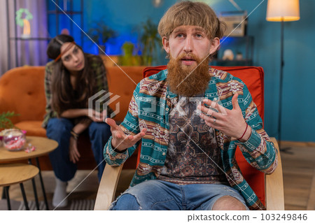 Aggressive man talking to camera about quarreling with woman at home, conflict at family couple Aggressive man talking to camera about quarreling with woman at home, conflict at family couple 103249846