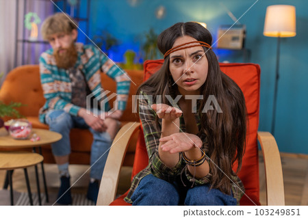 Aggressive woman talking to camera about quarreling with man at home, conflict at family couple Aggressive woman talking to camera about quarreling with man at home, conflict at family couple 103249851