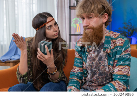 Aggressive family married couple man woman quarreling, shouting at each other, conflict at home 103249896