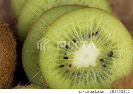 fresh green kiwi while cooking food in the kitchen 103250592