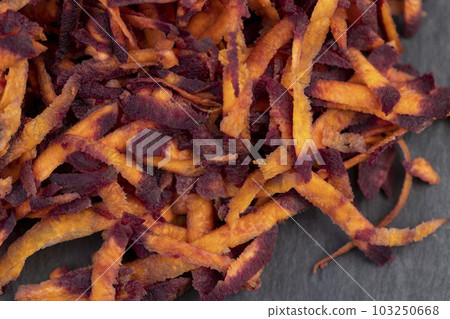 Finely grated red-orange carrots in the kitchen Finely grated red-orange carrots in the kitchen 103250668