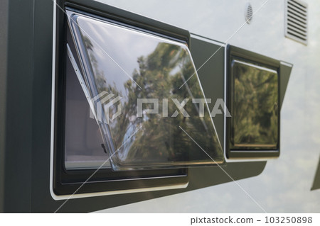 Close-up of a window in a motorhome, rest in a van 103250898