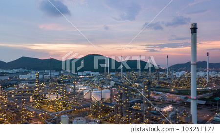 Aerial view white oil storage tank and oil refinery factory plant form industrial zone, Oil refinery and petrochemical plant factory, Business oil and gas refinery industrial factory power and energy. 103251172