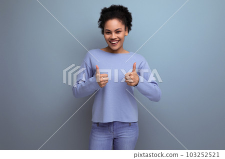 charming young 20s woman with afro hair in a bun shows like 103252521