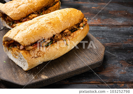 Tantuni, Traditional Turkish Kebap with Chicken, on old dark wooden table background, with copy space for text Tantuni, Traditional Turkish Kebap with Chicken, on old dark wooden table background, with copy space for text 103252798