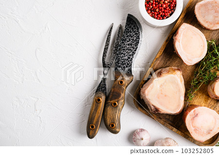 Beef Bones for Making Broth, on white stone table background, top view flat lay, with copy space for text Beef Bones for Making Broth, on white stone table background, top view flat lay, with copy space for text 103252805