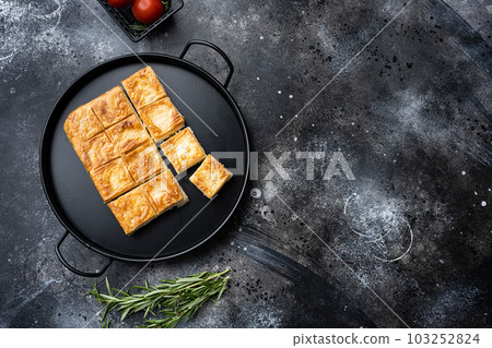 Su Boregi Turkish Patty with tea , top view flat lay, on black dark stone table background, with copy space for text Su Boregi Turkish Patty with tea , top view flat lay, on black dark stone table background, with copy space for text 103252824