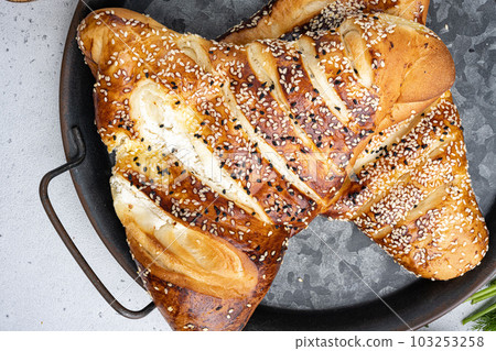 Burekas filled with cheese painir , on gray concrete table background, top view flat lay Burekas filled with cheese painir , on gray concrete table background, top view flat lay 103253258