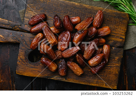 Ramadan dates is traditional food for iftar in islamic world set, on old dark wooden table background, top view flat lay Ramadan dates is traditional food for iftar in islamic world set, on old dark wooden table background, top view flat lay 103253262