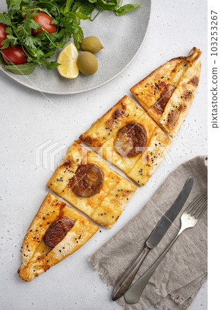 Kasarli sucuklu pide, on gray concrete table background, top view flat lay 103253267