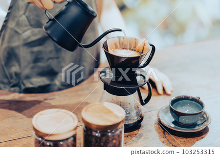 A young female clerk dripping coffee faceless 103253315