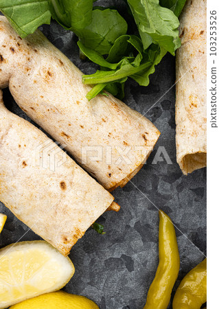Tavuk tantuni durum Turkish cuisine doner kebab, close up macro, top view flat lay 103253526