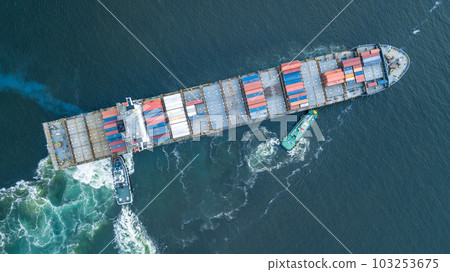 Aerial view container ship and tugboat drag shipping to seaport, Container ship load container for global business logistics import export, Freight shipping and transportation. Aerial view container ship and tugboat drag shipping to seaport, Container ship load container for global business logistics import export, Freight shipping and transportation. 103253675