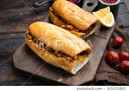 Somun ekmek tavuk tantuni Chicken Turkish kebab, on old dark  wooden table background 103253861