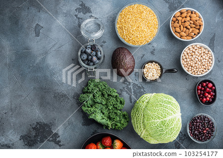 Balanced diet organic healthy food clean eating selection, flat lay with space for text, on grey background Balanced diet organic healthy food clean eating selection, flat lay with space for text, on grey background 103254177