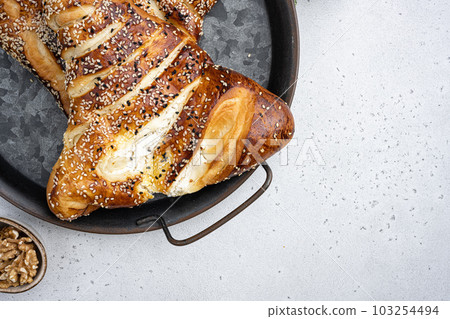 Turkish pastry filled with cheese, on gray concrete table background, top view flat lay, with copy space for text 103254494