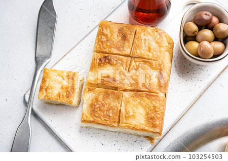 Delicious Turkish food Tray pastry with cheese, on gray concrete table background, top view flat lay 103254503