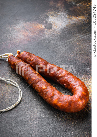 Spanish chorizo salami sausage on old metall background Spanish chorizo salami sausage on old metall background 103254749