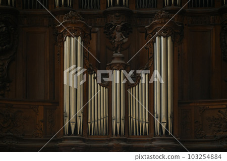 The organ in the church and the carved old wood around 103254884