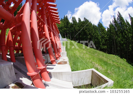Shinshu Otari village erosion control facility Gansawa erosion control dam characterized by large vermillion steel slits 103255165