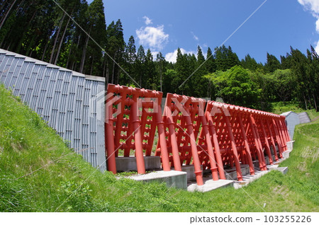 Shinshu Otari village erosion control facility Gansawa erosion control dam characterized by large vermillion steel slits 103255226