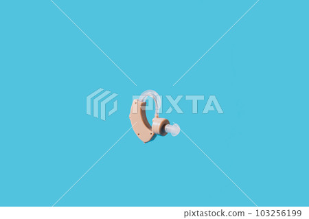 Hearing aid flies against a blue background Hearing aid flies against a blue background 103256199