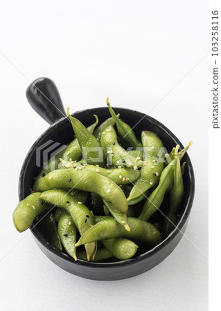japanese edamame beans snack in black ceramic bowl on white background japanese edamame beans snack in black ceramic bowl on white background 103258116