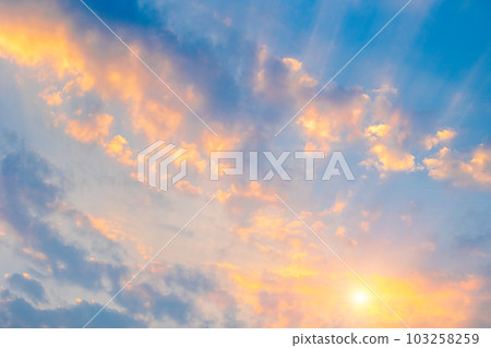 Beautiful sunset or sunrise morning day sky scatter clouds with dramatic light. 103258259