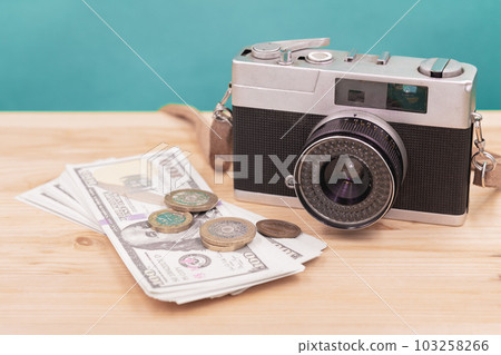vintage camera with fake money for sell photograph or stock image photographer business career concept vintage camera with fake money for sell photograph or stock image photographer business career concept 103258266