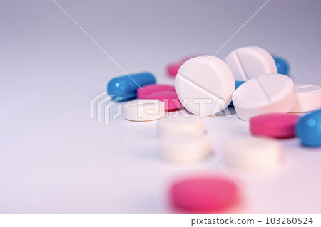 Pills on a white background. 103260524