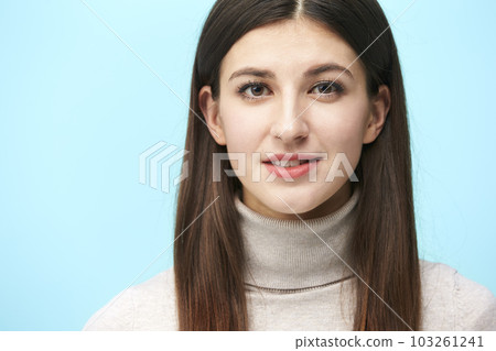 portrait of a beautiful young caucasian woman, head shot, looking at camera smiling portrait of a beautiful young caucasian woman, head shot, looking at camera smiling 103261241